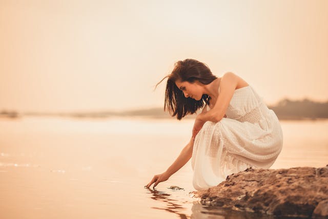 Woman touching the water